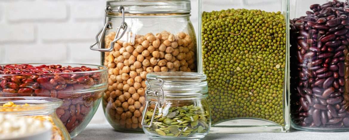 Well-organized refrigerator filled with containers of batch-cooked meals featuring pulses and lentils - simplifying meal prep with nutritious and delicious dishes.